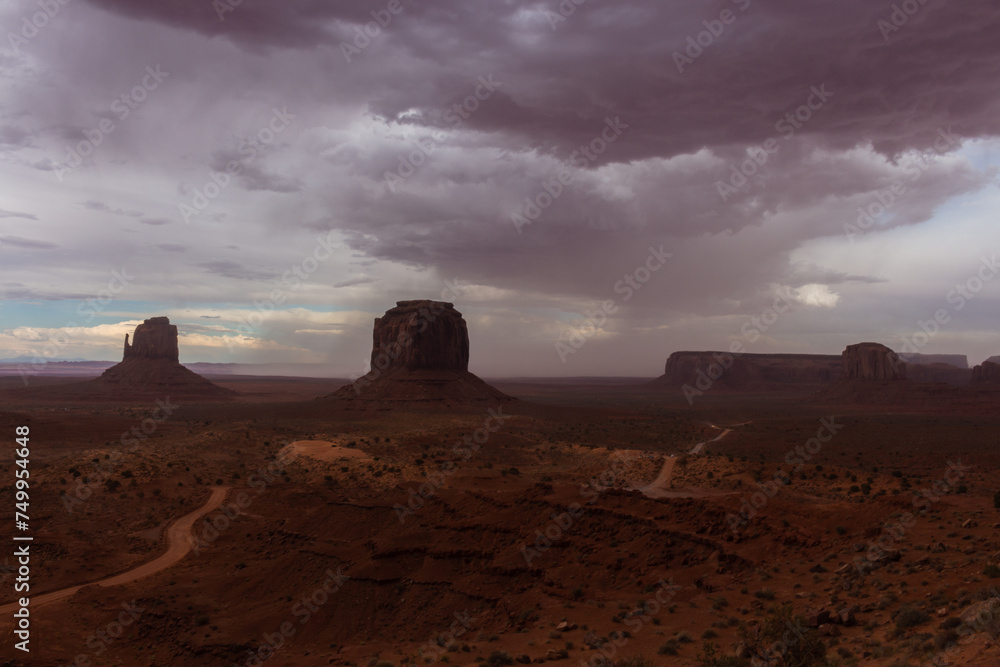 The Monument Valley Navajo Tribal Park in Arizona, USA. View of the East Mitten Butte, Merrick Butte, Elephant Butte, and the Artist's Point Monuments during a storm.