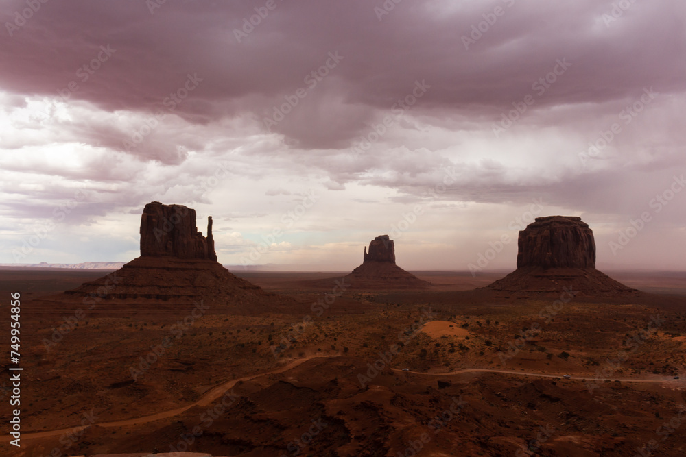 The Monument Valley Navajo Tribal Park in Arizona, USA. View of the West Mitten Butte, East Mitten Butte, and Merrick Butte Monuments.