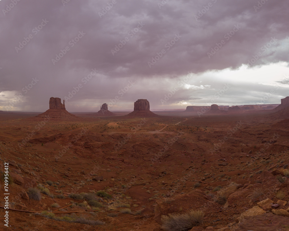 The Monument Valley Navajo Tribal Park in Arizona, USA. View of the West Mitten Butte, East Mitten Butte, and Merrick Butte Monuments.