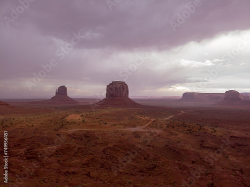 The Monument Valley Navajo Tribal Park in Arizona, USA. View of the East Mitten Butte, Merrick Butte, Elephant Butte, and the Artist's Point Monuments during a storm. photo