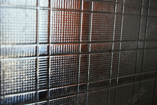 Glass dented background in the form of square wafers, squares and direct reliefs