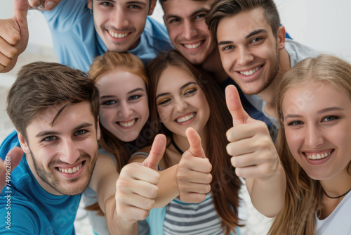 Group of people thumbing up and smiling happily, positive people background