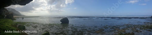Panorama from the rocky cove to the tropical ocean