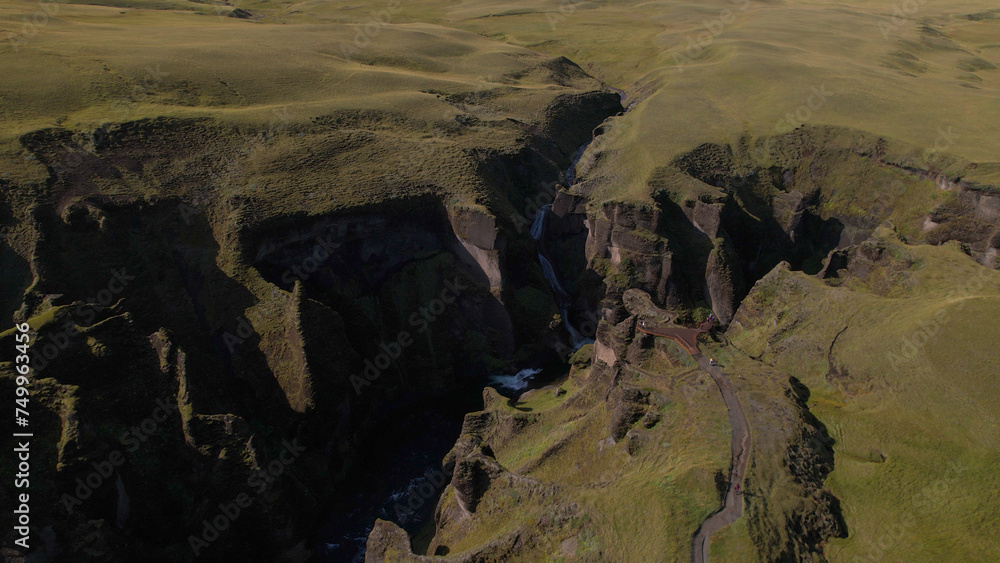 Fjadrargljufur (or Fjadra Canyon) is a 100 m deep and about 2 kilometres long serpentine canyon with the Fjaðrá river flowing through it, South Iceland.