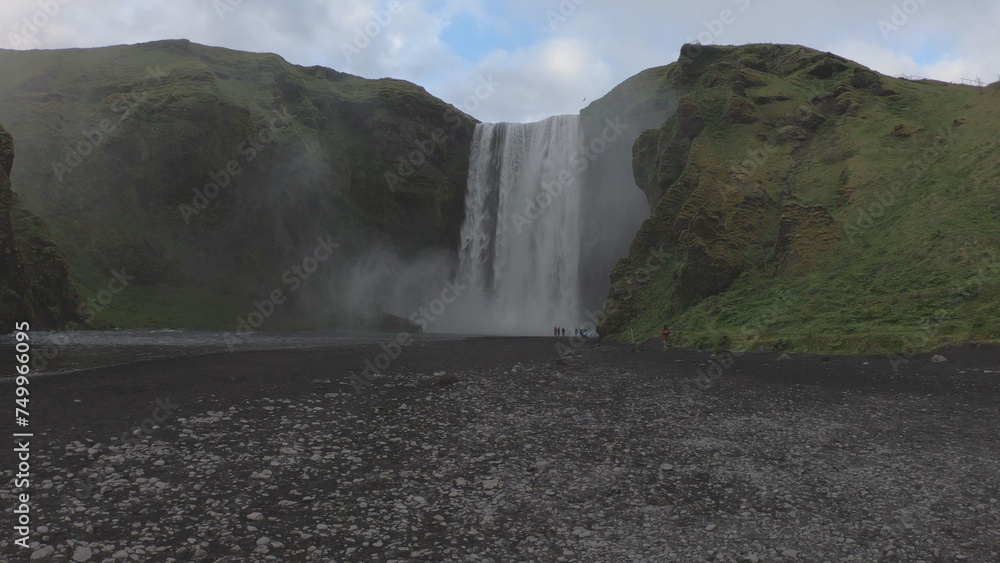 The beautiful 60-meter high Skogafoss Waterfall, situated on the Skoga River in the south of Iceland at the cliffs of the former coastline.