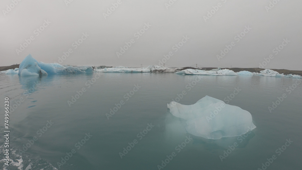 View from a boat of Jokulsarlon Glacier Lagoon in Iceland. Melting icebergs floating.