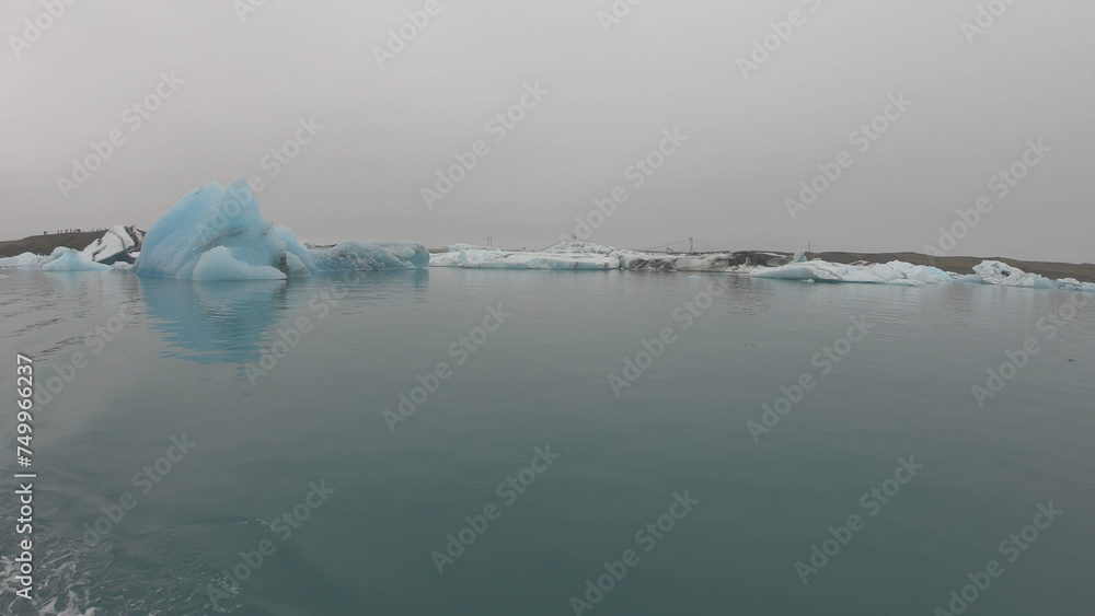 View from a boat of Jokulsarlon Glacier Lagoon in Iceland. Melting icebergs floating.