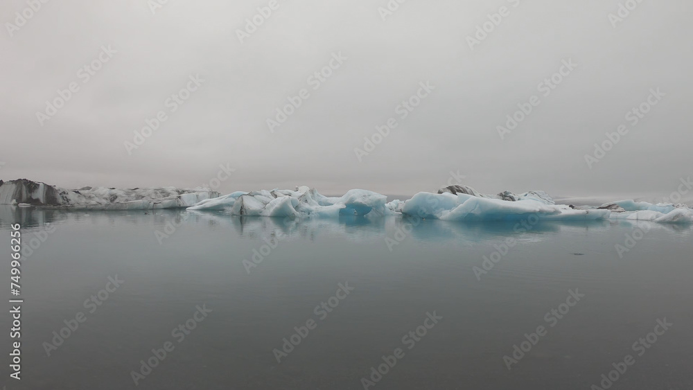 View from a boat of Jokulsarlon Glacier Lagoon in Iceland. Melting icebergs floating.