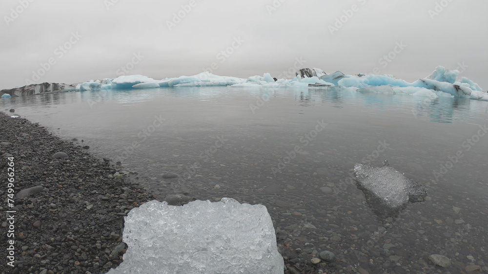 View from a boat of Jokulsarlon Glacier Lagoon in Iceland. Melting icebergs floating.