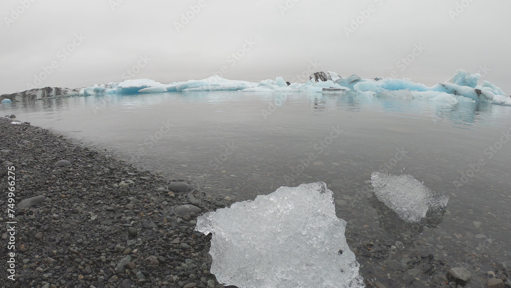 View from a boat of Jokulsarlon Glacier Lagoon in Iceland. Melting icebergs floating.