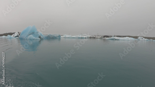 View from a boat of Jokulsarlon Glacier Lagoon in Iceland. Melting icebergs floating.