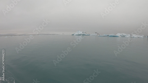 View from a boat of Jokulsarlon Glacier Lagoon in Iceland. Melting icebergs floating.