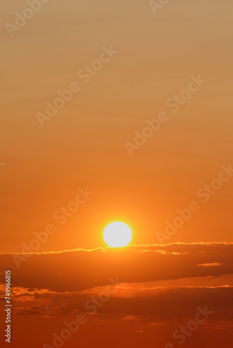 Sunset over the sea with orange sky and clouds  background.