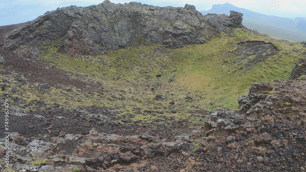 Saxholl is a 45 meter high volcanic, oval-shaped crater. It rises up from the moss-covered lava fields in Snaefellsjokull National Park on the Snaefellsnes peninsula West Iceland.