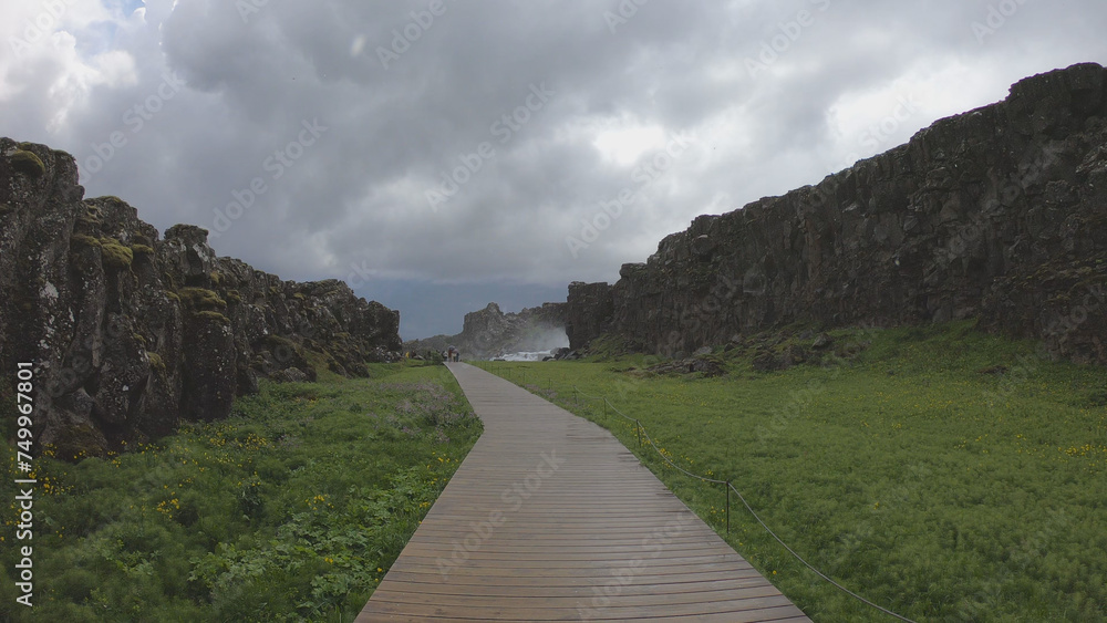 Oxararfoss is a waterfall situated within Þingvellir National Park in Southwest Iceland. The waterfall flows out the river Oxará, cascading in two drops over the cliffs of Almannagjá gorge.
