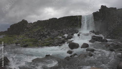 Obraz na płótnie Oxararfoss is a waterfall situated within Þingvellir National Park in Southwest Iceland. The waterfall flows out the river Oxará, cascading in two drops over the cliffs of Almannagjá gorge. w salonie
