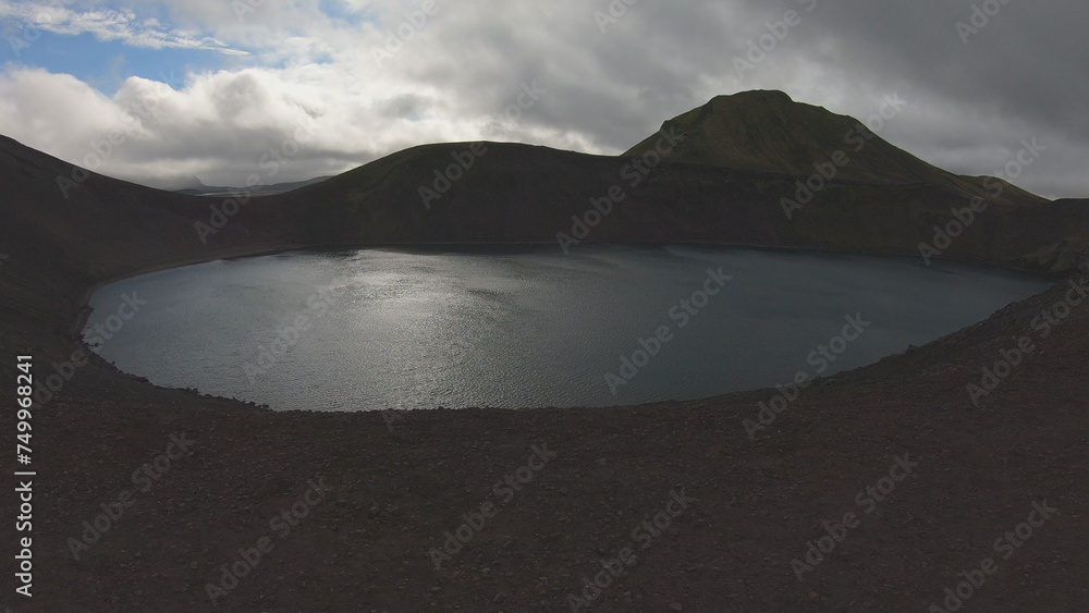 Blahylur lake, spelled Bláhylur in Icelandic and also known as Hnausapollur, is a stunning crater lake located near Landmannalaugar in the Southern Highlands, Iceland.