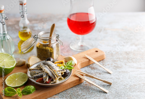 anchovy appetizer with olives.