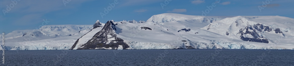 Panorama of snow covered mountains around a bay at Portal Point, Antarctica Panorama of snow covered mountains around a bay at Portal Point, Antarctica