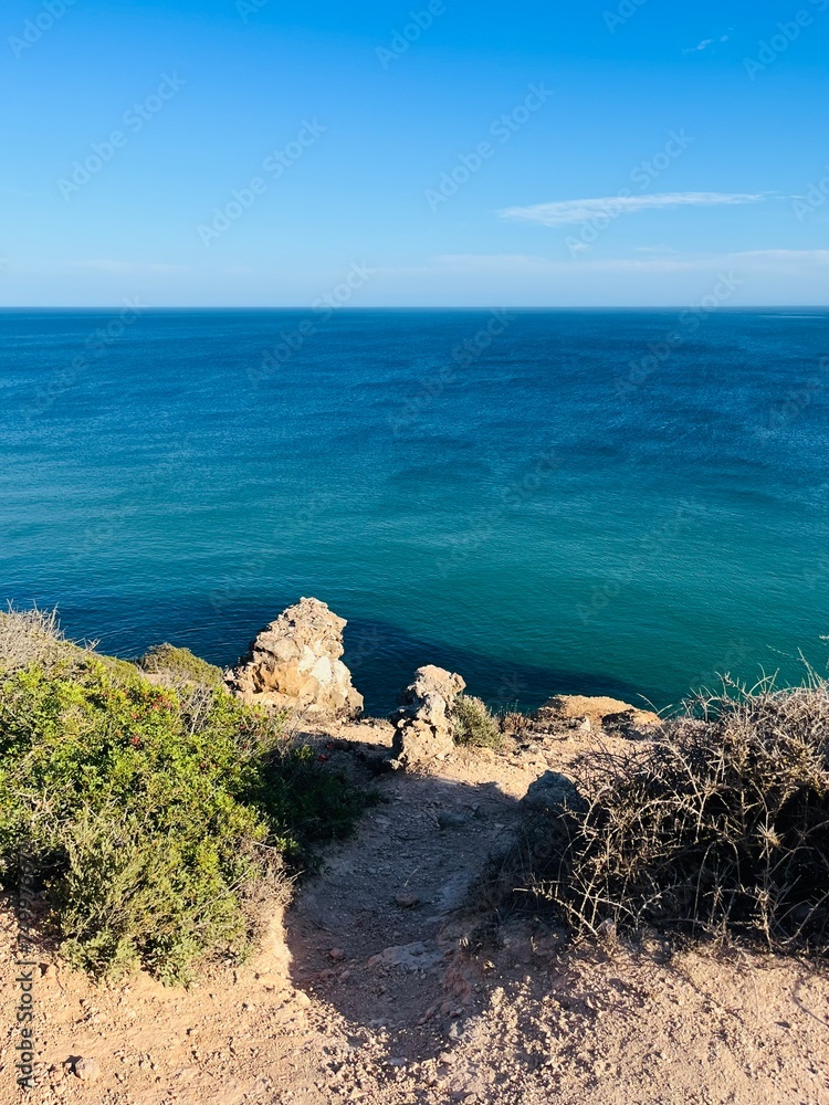 Blue ocean horizon, rocky coast, ocean bay Blue ocean horizon, rocky coast, ocean bay