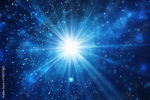 Image of blue star starburst glowing on a dark background, concept of dispersion, explosion, beautiful sparkling light.