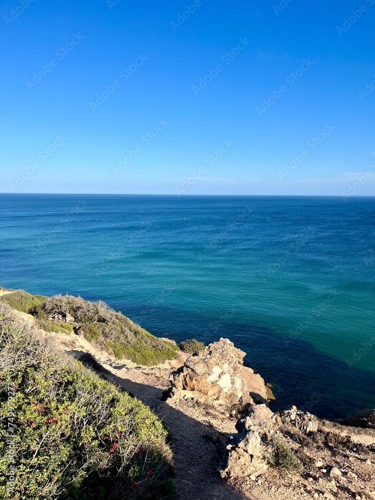 Blue ocean horizon, rocky coast, ocean bay