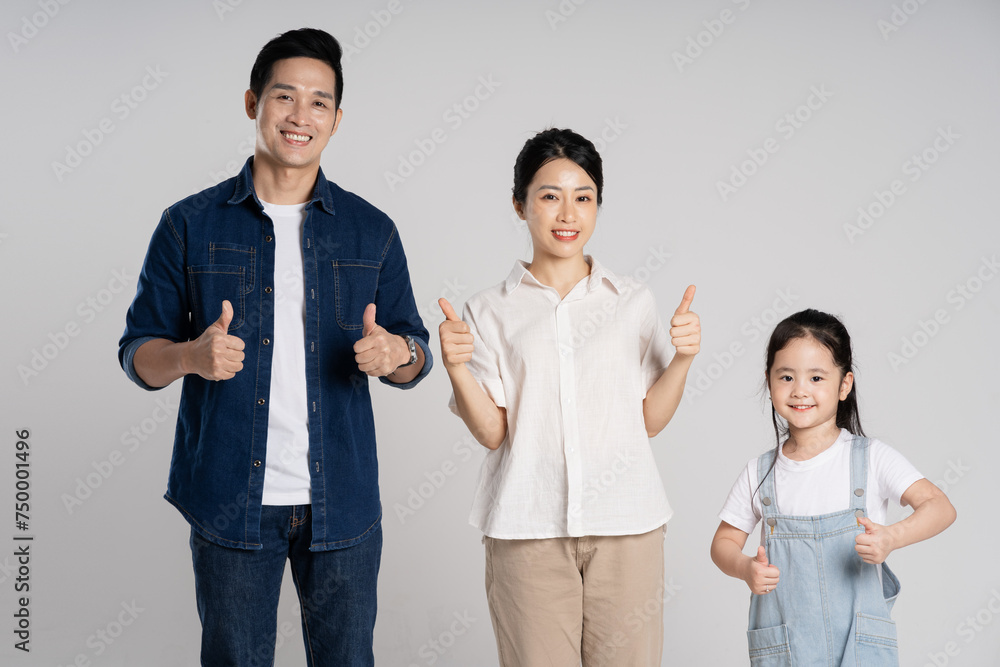 Asian family portrait posing on white background Asian family portrait posing on white background