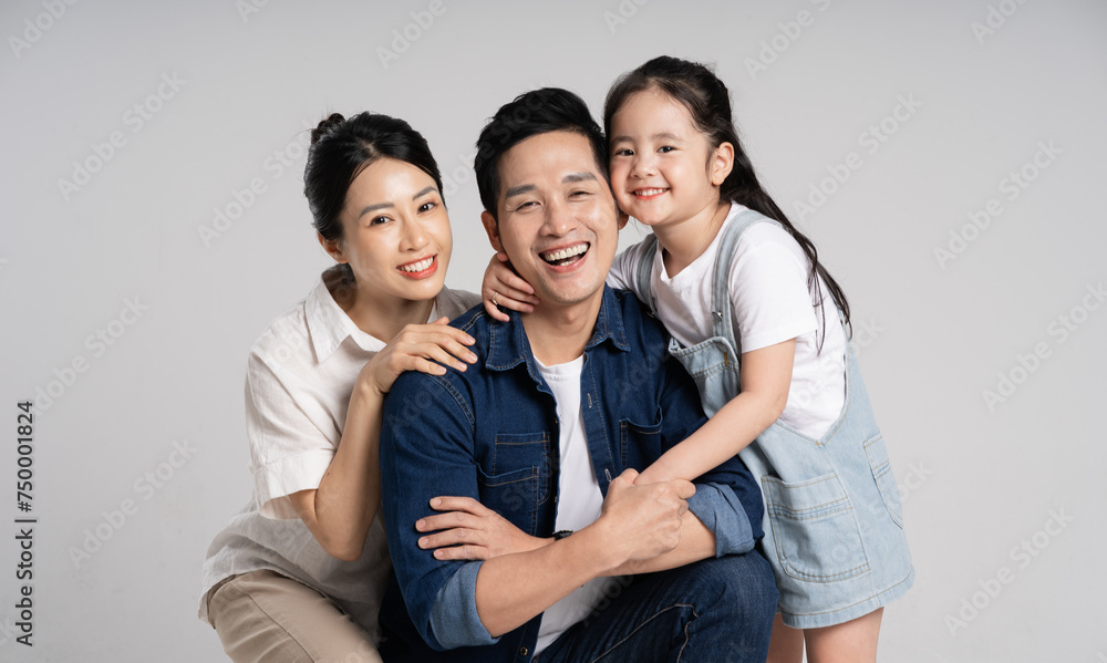 Asian family portrait posing on white background Asian family portrait posing on white background