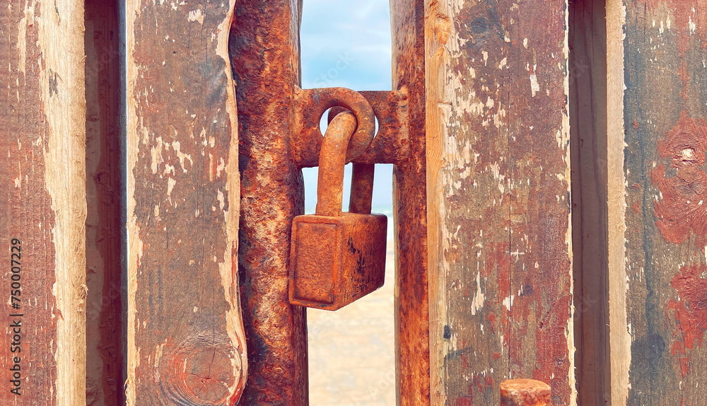Secured Memories: An Old Rusty Padlock on a Weathered Door. The Story of Time Told Through Corrosion and Peeling Paint Secured Memories: An Old Rusty Padlock on a Weathered Door. The Story of Time Told Through Corrosion and Peeling Paint