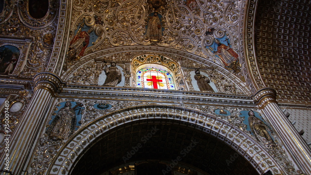 Stained glass window below a vaulted ceiling in the Church and Convent of Santo Domingo de Guzman in Oaxaca, Mexico