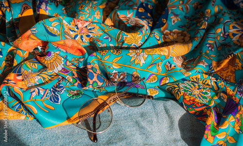Wardrobe details. Trends on a hippie style, 70s. Silk clothes and glasses