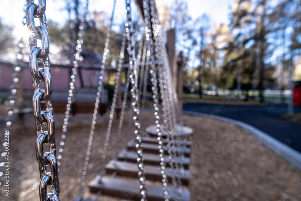 Swing on chains in the park for games.