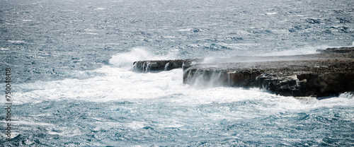 Banner with a seascape during a storm. Big waves in the ocean crash against the rocks © Armands photography