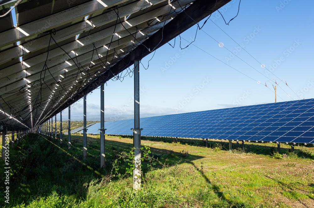 Double solar perspective: Panel details under clear blue sky. Double solar perspective: Panel details under clear blue sky.
