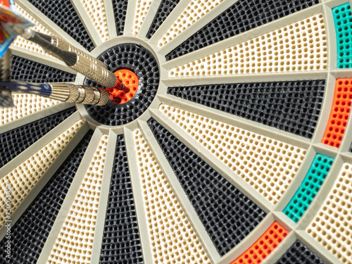 dart board with darts. dart in the target. concept hitting the target