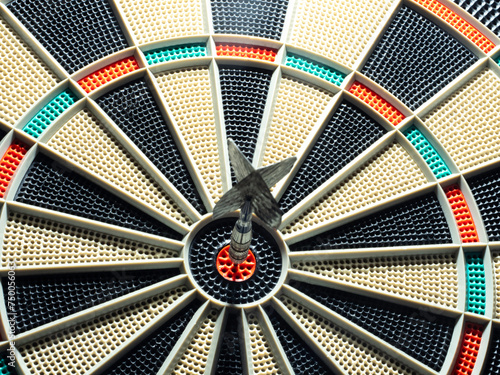 dart board with darts. dart in the target. concept hitting the target