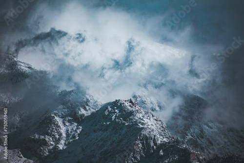 Snowcapped mountains against blue sky. © Picsverge