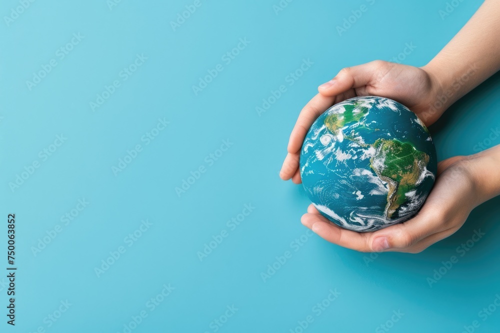 close up Hands holding earth globe, leaves and flowers on background, space for text, earth day close up Hands holding earth globe, leaves and flowers on background, space for text, earth day