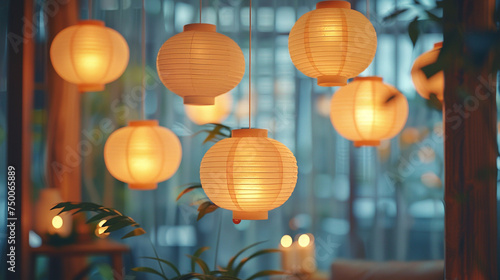 A cluster of paper lanterns suspended from the ceiling, casting a soft, diffused light that bathes the room in a tranquil glow. photo