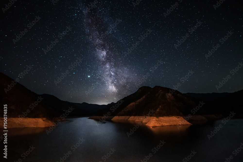 amazing night sky stars panorama with milky way on mountain lake background