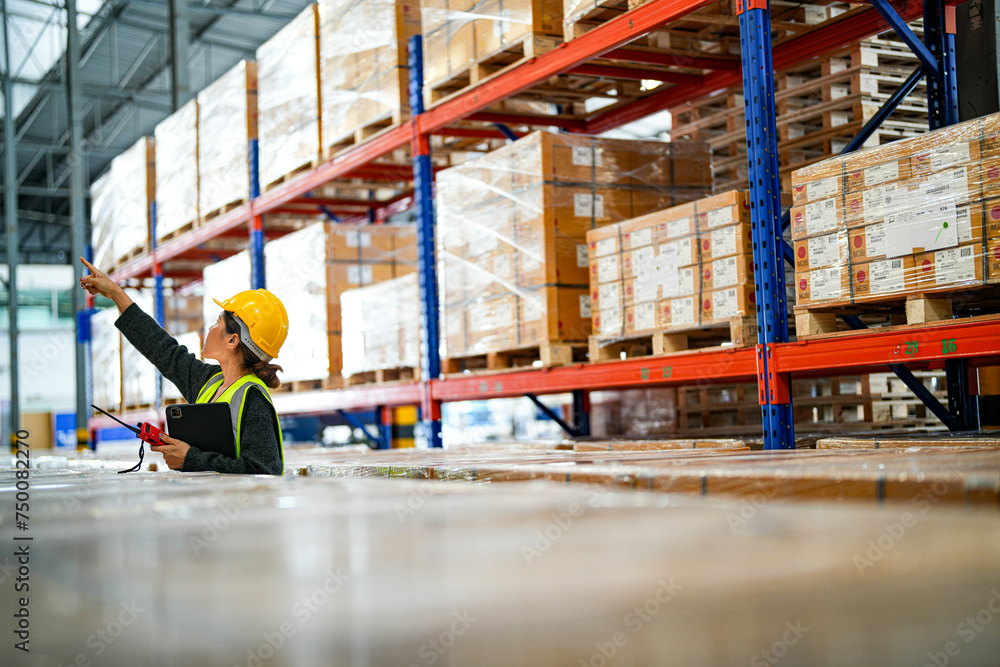 operation worker woman checking and inspecting cargo for stack items for shipping. Staff checking the store factory. industry factory warehouse. Worker Scanning Package In Warehouse. operation worker woman checking and inspecting cargo for stack items for shipping. Staff checking the store factory. industry factory warehouse. Worker Scanning Package In Warehouse.
