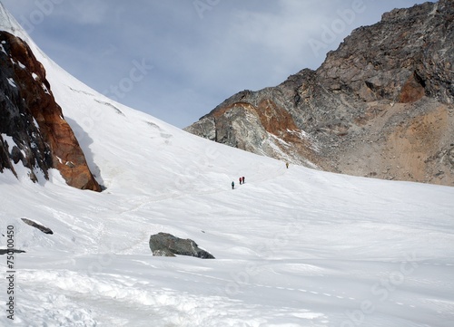 hikers, trekkers, mountaineers, white snow plain glacier