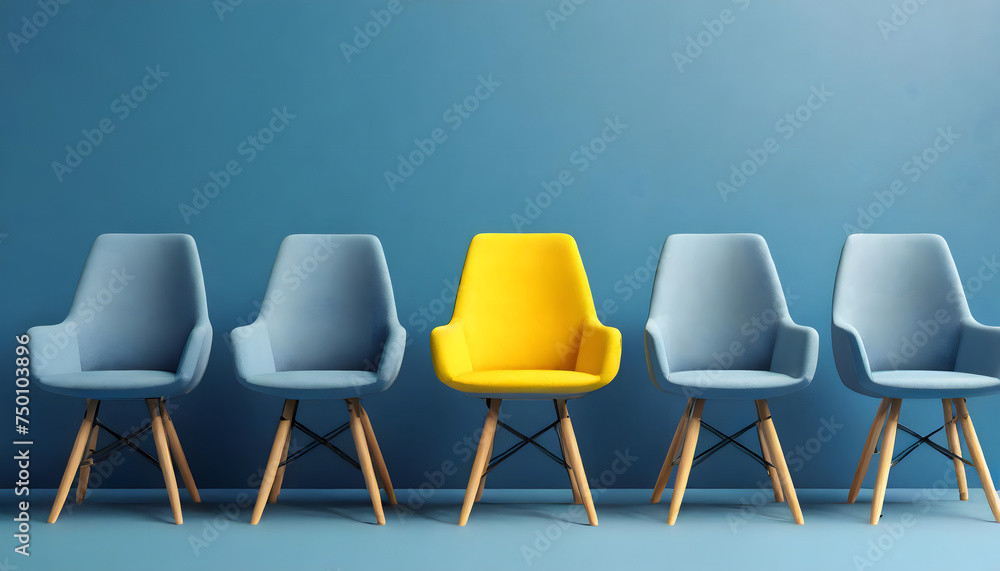 A yellow chair standing out from the crowd of chairs against a blue studio background. A yellow chair standing out from the crowd of chairs against a blue studio background.