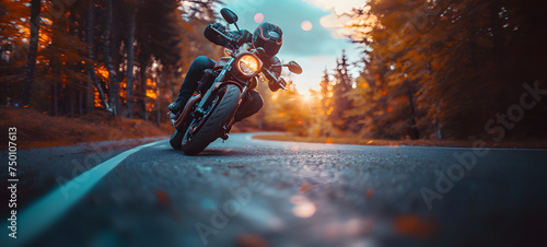 Motorcyclist riding on the road. A motorcycle rider speeding on a road. Adventure and travel concept. © mandu77