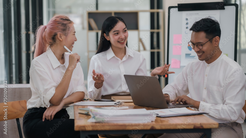 Group of Asian business people discussing business plans at a meeting. Group of Asian business people discussing business plans at a meeting.
