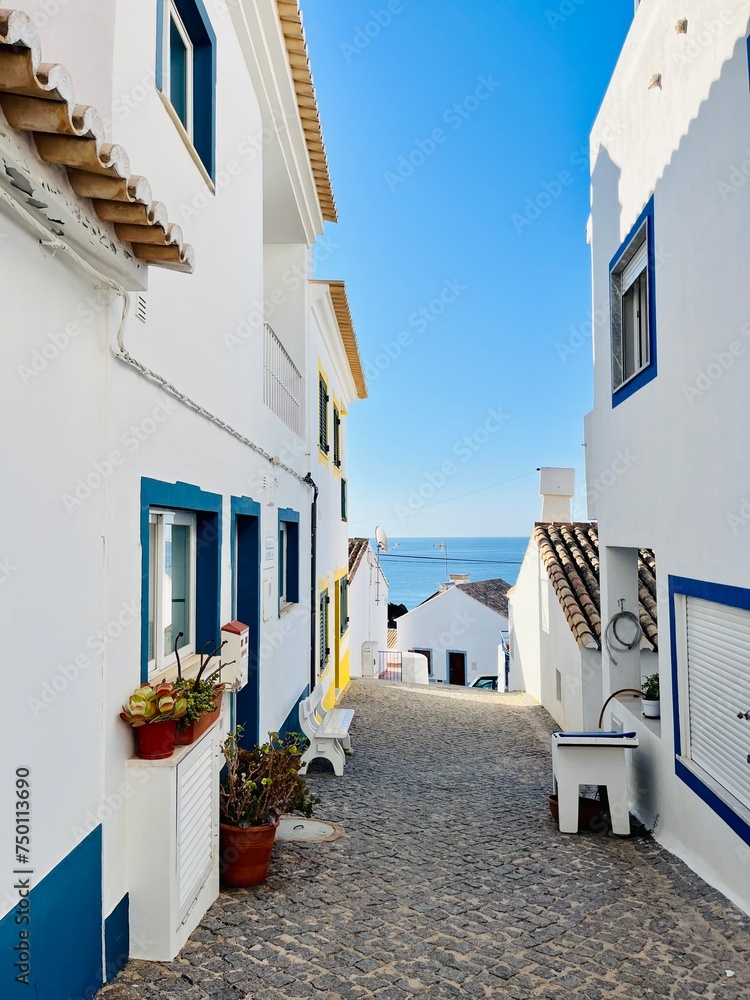 Houses with white walls, small and cozy sea town, streets of an traditional Portuguese sea town 
