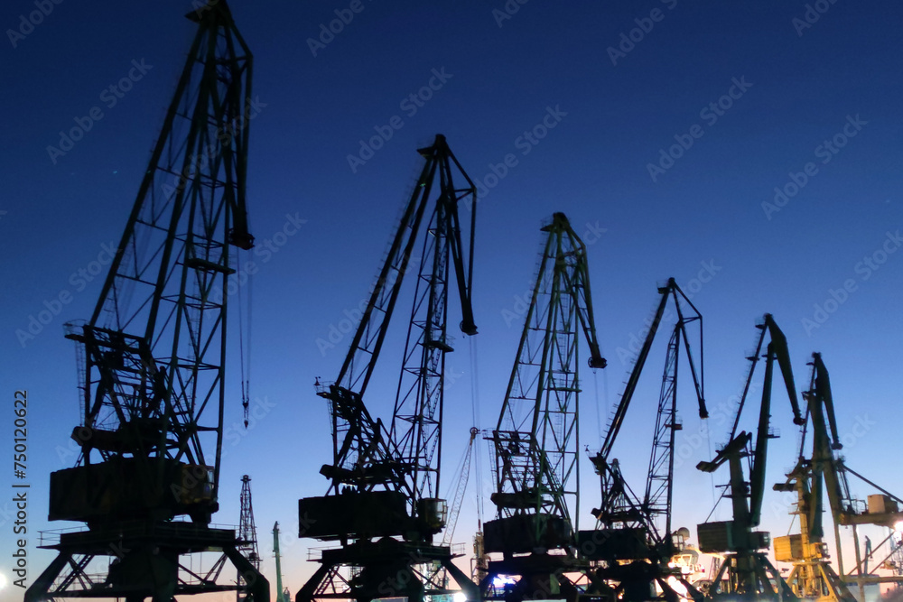 port cranes against the backdrop of a beautiful sunset