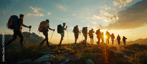 Group tourists of hiker sporty people walks in mountains at sunset with backpacks. Concept adventure 