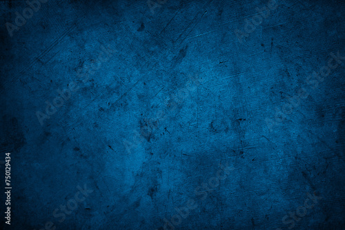 Dark blue textured concrete grunge wall background © Stillfx