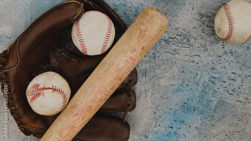 Old vintage baseball balls with glove and bat as sports flat lay background, copy space on grunge texture.